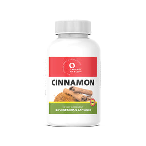 cinnamon Vitamin supplement bottle, 120 veg capsules  by organic world, with a red, green and white  label, on a white background